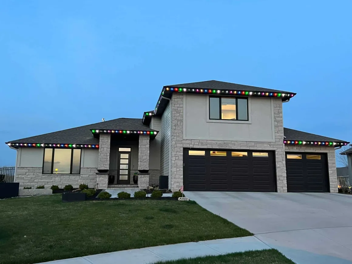 Suburban Denver home with multicolor holiday roofline lighting