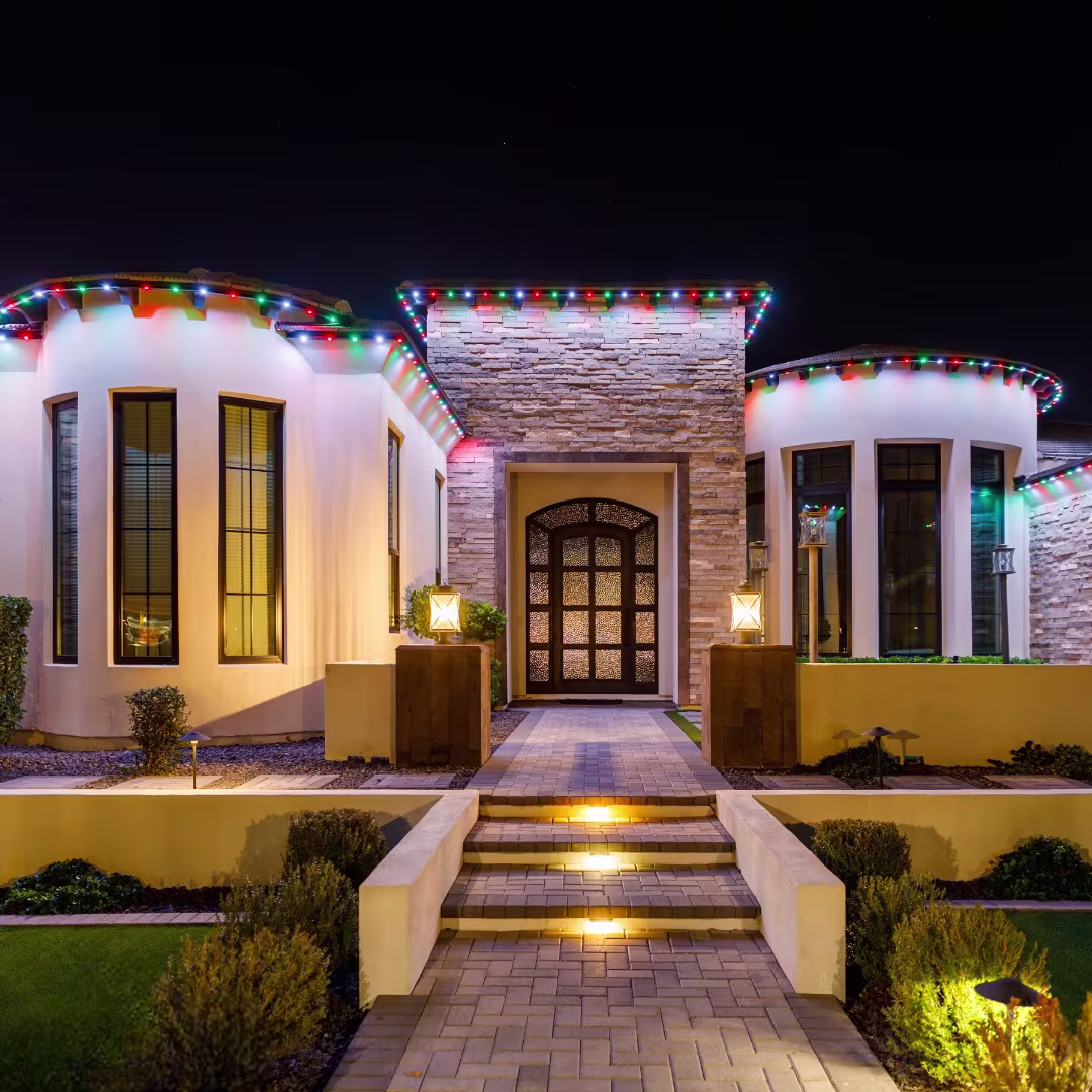 Home lit for the holidays with permanent color lighting
