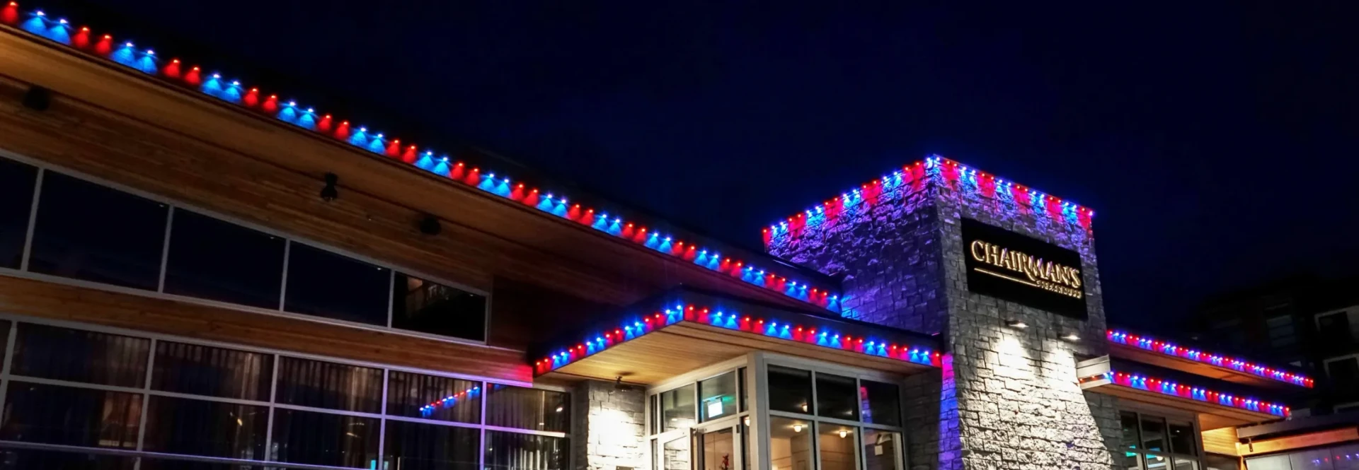 Restaurant with red and blue colorful roofline lighting