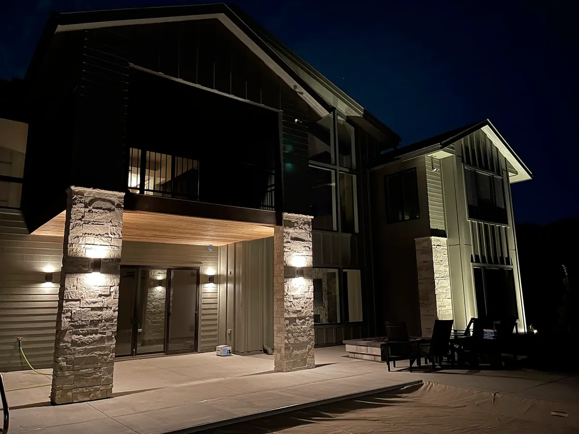 Contemporary home with architectural and patio lighting